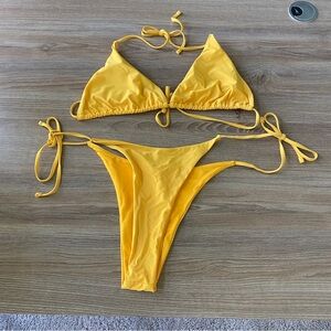 Yellow bikini set with adjustable straps and tie-up bottoms